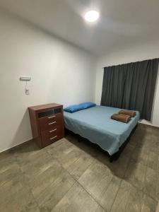 Ένα ή περισσότερα κρεβάτια σε δωμάτιο στο Departamento Doña Elba