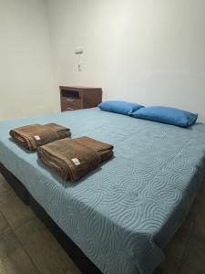 Ένα ή περισσότερα κρεβάτια σε δωμάτιο στο Departamento Doña Elba +4 φωτογραφίες