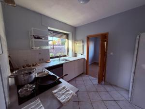 a kitchen with a sink and a stove in it at FeWo 5Z Terasse 2 Bad in Lingen