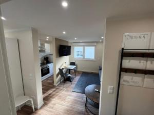 a small apartment with a kitchen and a living room at Lumio Apartment 2 - Klimatisiert - Coffee for free - in Karlsruhe