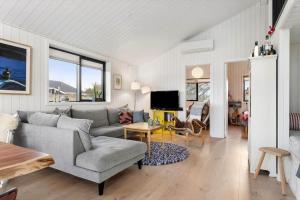 a living room with a couch and a table at 1071-Thisted-Gravsesvej-30 in Klitmøller