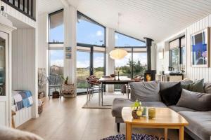 a living room with a couch and a table at 1071-Thisted-Gravsesvej-30 in Klitmøller