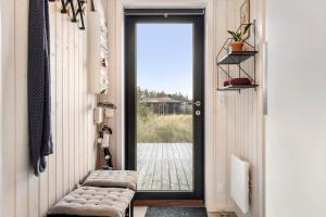 a hallway with a door leading to a patio at 1071-Thisted-Gravsesvej-30 in Klitmøller
