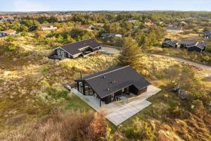 an overhead view of a house in a field at 1071-Thisted-Gravsesvej-30 in Klitmøller