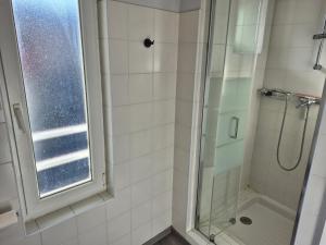 a bathroom with a shower and a window at L'industriel - Lourdes Centre in Lourdes +7 photos
