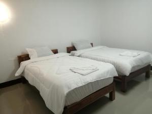 En eller flere senge i et værelse på ชมวิว บึงโขงหลง