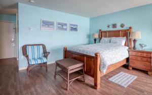 Ένα ή περισσότερα κρεβάτια σε δωμάτιο στο Oceans Edge - Anchor Pier Lodge