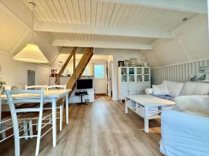 a living room with a table and a couch at M398-Gedser-Gedser-Feriepark-32 in Gedser