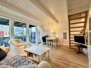 a living room with a couch and a table at M398-Gedser-Gedser-Feriepark-32 in Gedser