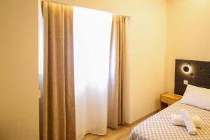 Ένα ή περισσότερα κρεβάτια σε δωμάτιο στο GUMBELA - Hotel +6 φωτογραφίες