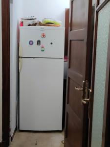 Kuchyň nebo kuchyňský kout v ubytování Chambre Douillet Pour Nuit Complice