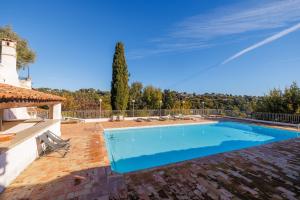 a swimming pool in the backyard of a house at Villa Miradou in Saint Paul de Vence