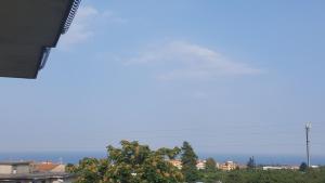 a view of the ocean from a city at Tra L'Etna e il Mare in Giarre