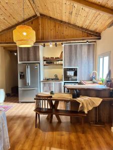 a kitchen with a table in the middle of a room at Hathors Terrace Apartment in Luxor