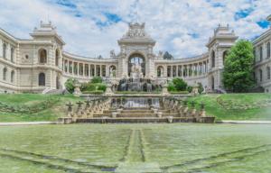 a large building with a fountain in front of it at Incroyable Vue mer et Notre Dame in Marseille