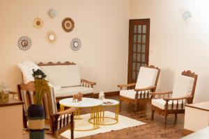 a living room with a couch and chairs and a table at COCOONING HOME # Centre-Ville # Confort # Charmant # マダガスカルのゲストハウス in Antananarivo +32 photos