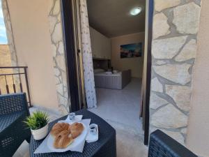 a table with two loaves of bread on a plate at House Calamigna in Ventimiglia di Sicilia