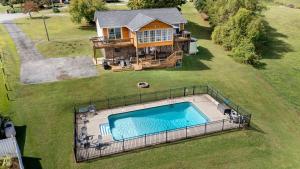 an aerial view of a house with a swimming pool at All Seasons Resort with Lake Access in Georgetown