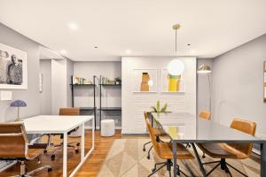 a dining room with a table and chairs at Outsite Chelsea in New York