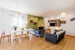a living room with a table and chairs and a dining room at Monemvasia modern flat nearby sea in Monemvasia