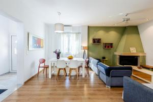 a living room with a table and a couch at Monemvasia modern flat nearby sea in Monemvasia