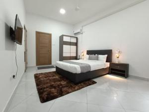 a bedroom with a bed and a television in it at Zivora Hotel And Restaurant in Mombasa