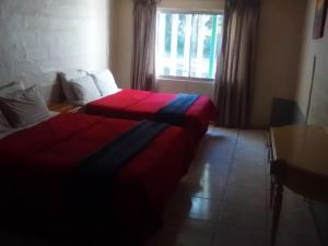 Ένα ή περισσότερα κρεβάτια σε δωμάτιο στο M AND M HOME FROM HOME +29 φωτογραφίες