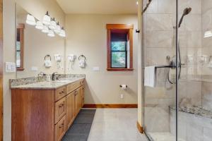 a bathroom with a shower and a sink at No. 3 Coal Mine Cabin & Studio in Ronald +26 photos