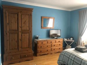 Giường trong phòng chung tại Home Thyme Holding