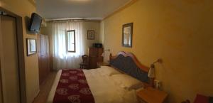 TV a/nebo společenská místnost v ubytování Meuble Villa Neve