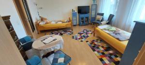 a living room filled with furniture and a tv at Ferienhaus - Wohnung- Havelblick in Phöben