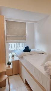 Ένα ή περισσότερα κρεβάτια σε δωμάτιο στο 73 Utagawa 2BR Apartment By MkStay