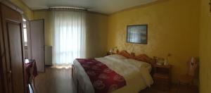 Postel nebo postele na pokoji v ubytování Meuble Villa Neve