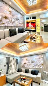 GuiguintoRelaxing 2BR Home Village Stay的客厅里有一张沙发和一张桌子。