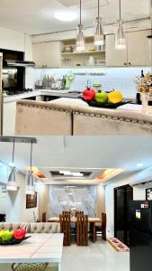 GuiguintoRelaxing 2BR Home Village Stay的带桌子的厨房和餐厅 更多2张照片