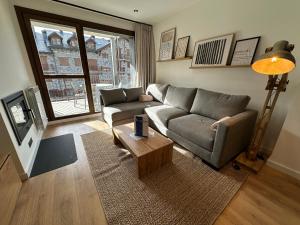 a living room with a couch and a coffee table at Villmor - B11 - Pichirillo in Benasque