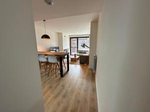 a dining room and living room with a table and chairs at Villmor - B11 - Pichirillo in Benasque