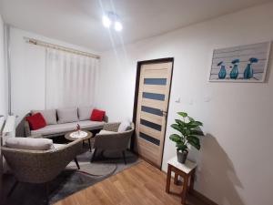 a living room with a couch and a table at Privat Teo Podtureň in Liptovský Mikuláš
