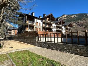 a large house on a hill with a fence at Villmor - B11 - Pichirillo in Benasque