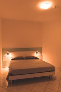 Ένα ή περισσότερα κρεβάτια σε δωμάτιο στο WowMilano Escape