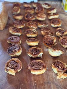 a bunch of bagels sitting on a wooden table at Casa Haydee Monteverde in Monteverde Costa Rica