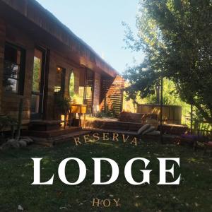 a book cover of a house with the words refuge at Cabina & Tinaja con vista al Rio Maipo in Pirque