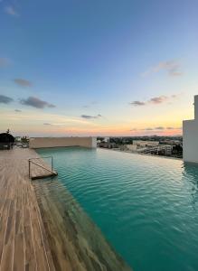 a pool of water on top of a building at Podium 3BR 2BH Modern Homestay Near Aeon in Kuching