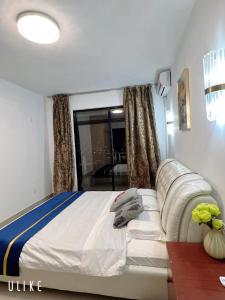 Ένα ή περισσότερα κρεβάτια σε δωμάτιο στο Appartements Haut-Standing de la Riviéra