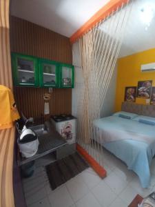 a bedroom with a bed and a hammock in it at Aracaju Suite - Seu Conforto no Coração da Capital in Aracaju +18 photos