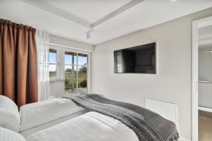 Ένα ή περισσότερα κρεβάτια σε δωμάτιο στο Alte Schule Westerhever Osterhever