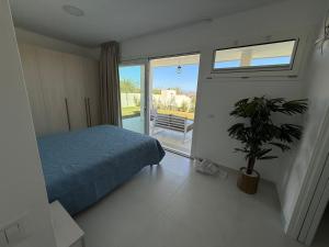 Ένα ή περισσότερα κρεβάτια σε δωμάτιο στο Acquamarina Apartment
