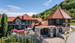 an aerial view of a house with a mountain at Villa Requiem in Bednja