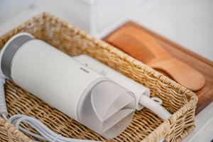 a wicker basket with a hair dryer and a hair dryer at 신흥부부공간a동 in Hamdŏng-ni +20 photos