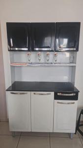 Køkken eller tekøkken på Casa com dois quartos em Itanhaém